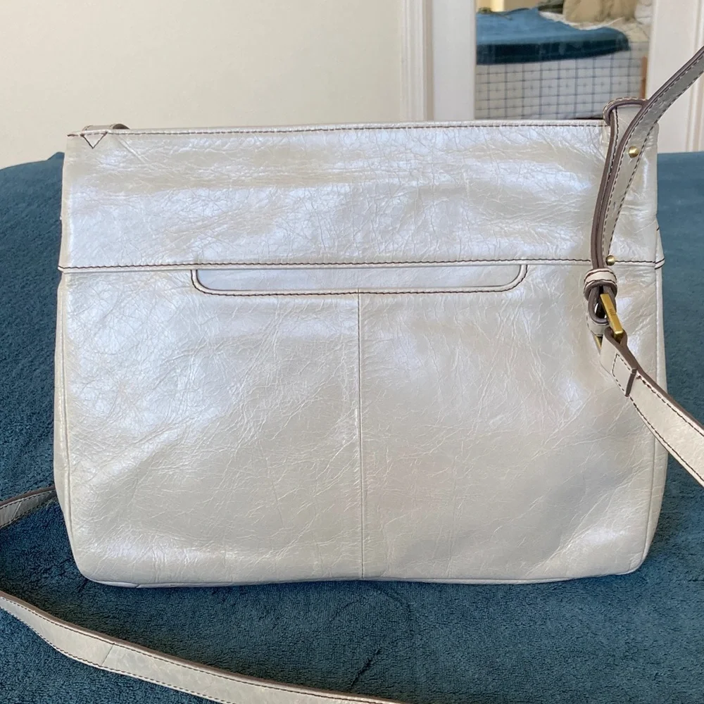 Hobo Larkin crossbody bag in a gray distressed leather